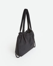 Black quilted drawstring bag