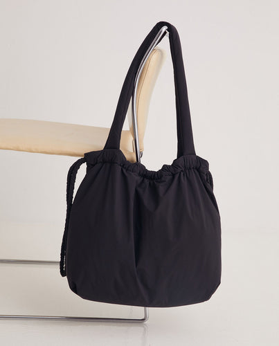 Black quilted drawstring bag